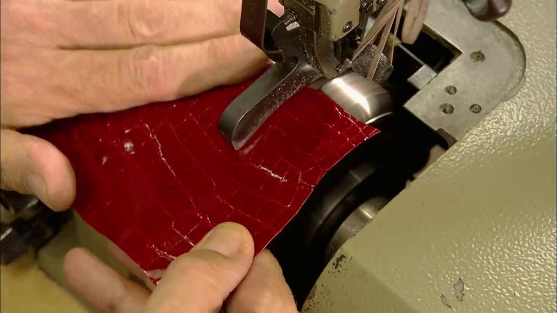 A plating machine applies heat and pressure