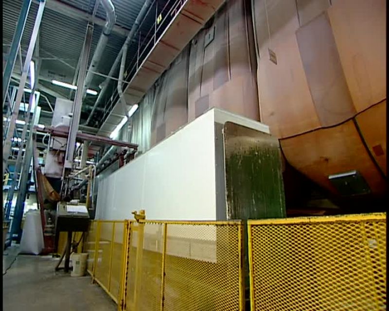 A SCALE BUILT INTO THE CONVEYOR BELT WEIGHS THE BLOCK
