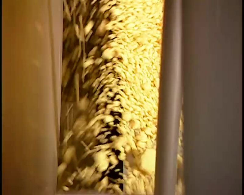 A SCREEN INSIDE THE DRUM SIFTS OUT THE BIG CLUMPS