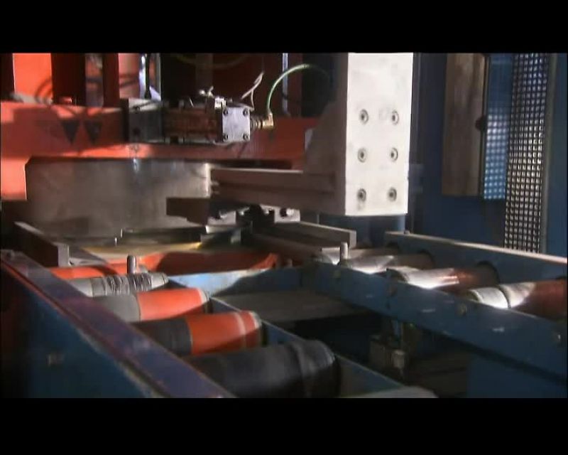 A SECOND PRESS CLAMPS THE DISK