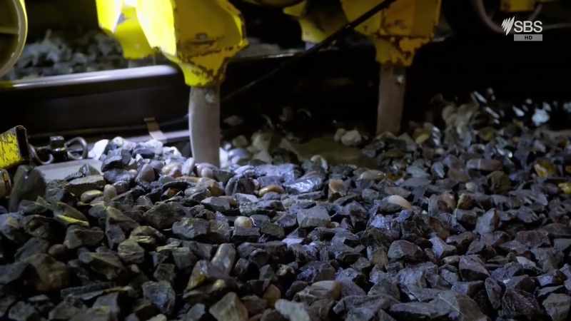 A special tamper machine helps the ballast settle