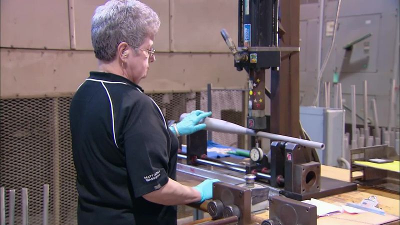 A TECHNICIAN MEASURES THE BAT
