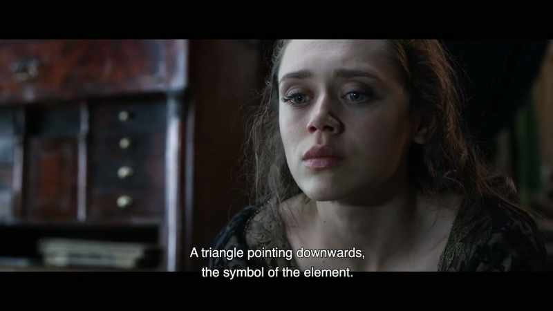 A triangle pointing downwards, the symbol of the element