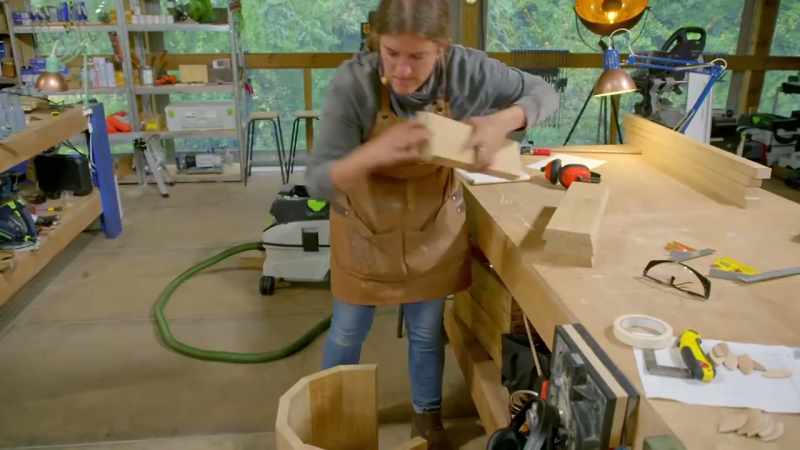 After cutting the sides of her planks at precise angles