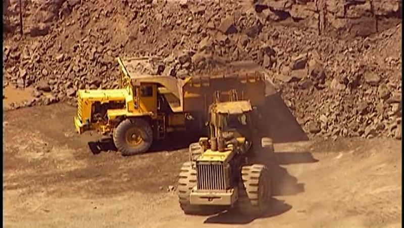 AFTER THE EXPLOSION, LOADERS MOVE IN