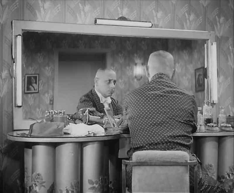 Al stood before the mirror