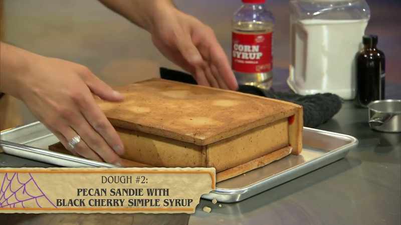 {\an8}That cookie, it's glued down to the bottom of the book