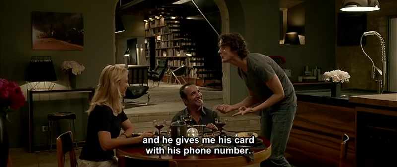 And he gives me his card with his phone number