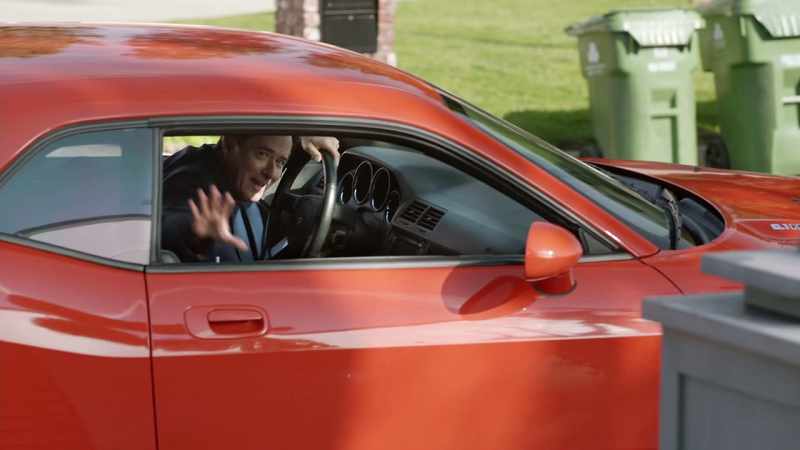 And he is here early.[rock music playing in car]