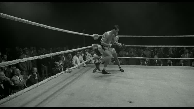 And he wobbles into the ropes and goes down!