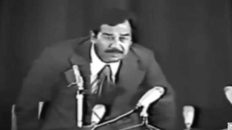 And Saddam comes with his famous cigar