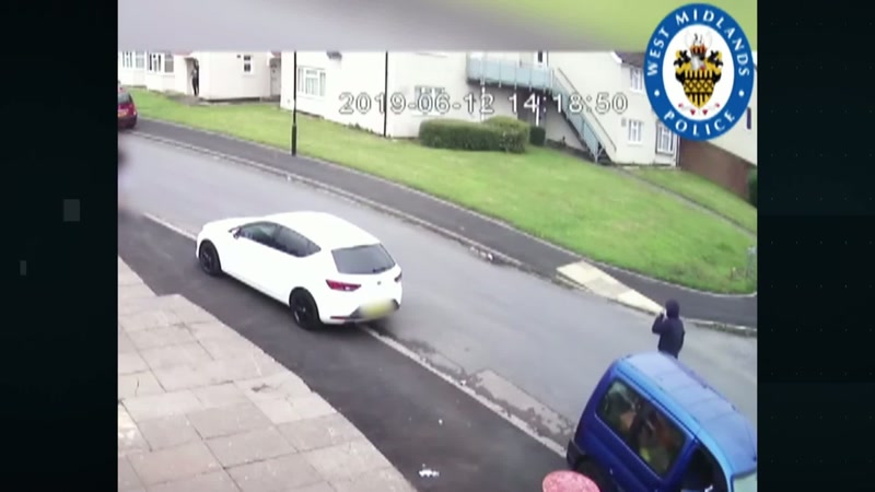 And we see a blue van forcefully and rapidly mounting the curb