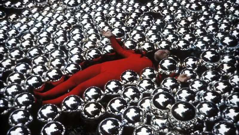 And she is dancing around and lying amid the balls