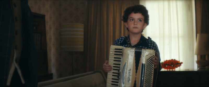 And why is my innocent young child wearing that devil's squeeze box?