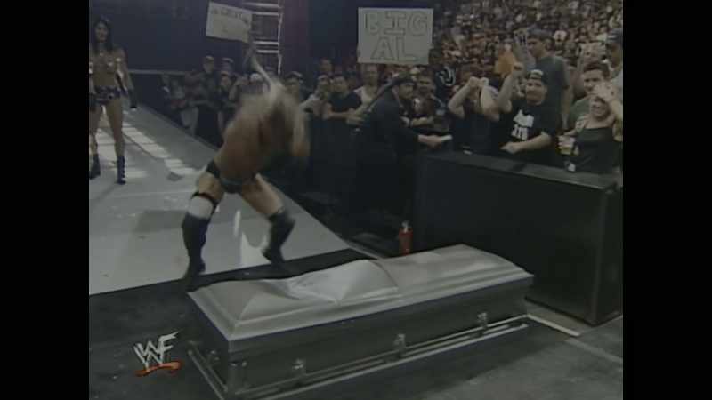 [announcer] The Rock is inside that casket!