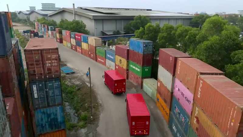 [Ari] The three trucks are leaving the port
