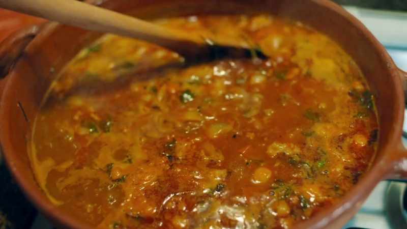 Arturo is preparing his famous charro beans