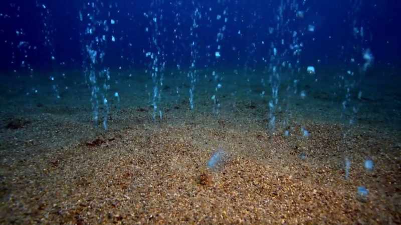 AS GASES BUBBLE UP THROUGH THE SALT CRUST