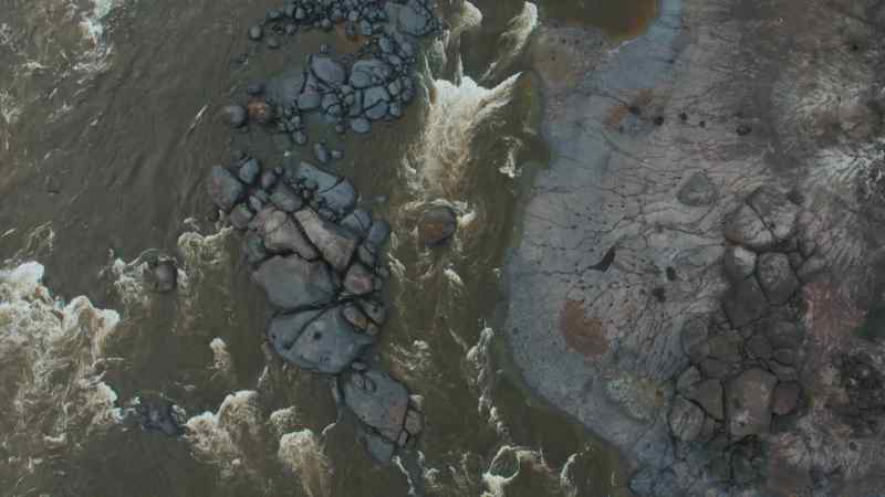 As river water flows downstream