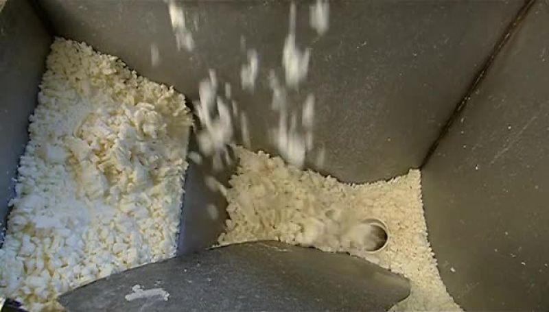 AS THE NOODLES FALL FROM THE EXTRUDER