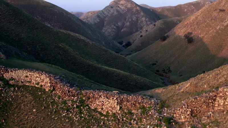 As the wall snaked on through valleys