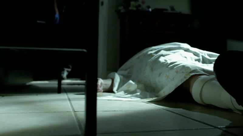 At this point, all you can see is a flowered bedspread