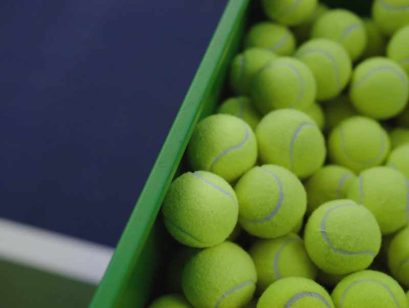 [ball launcher fires] - [racket stroke]