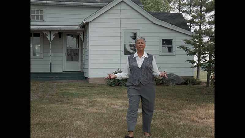 Behind me stands what most would call a normal-looking home