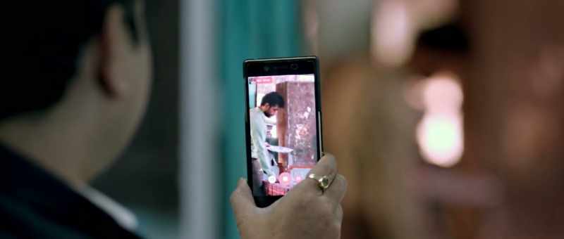 Behind the picture frame