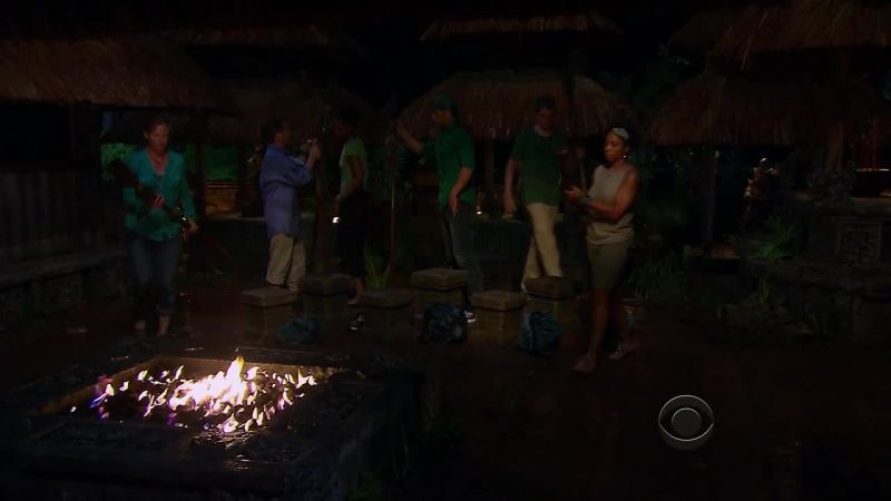 Behind you there is a torch, pick one