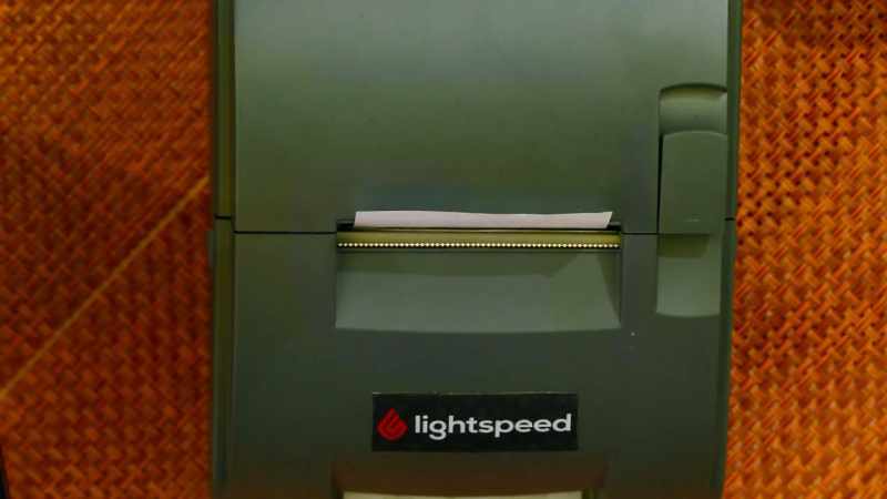 [bell chimes] - [computer] {\an8}Ticket printing