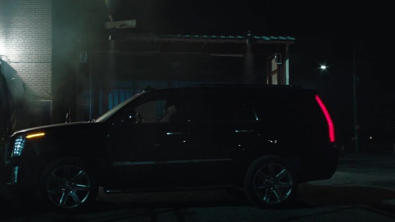 Black Escalade just pulled in