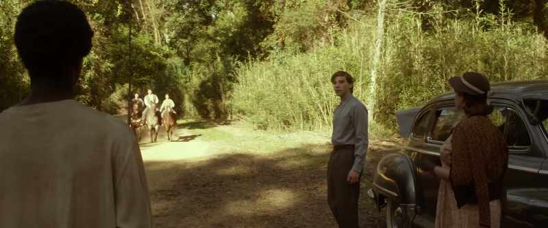'Bout that time, trouble came down the road on three horses