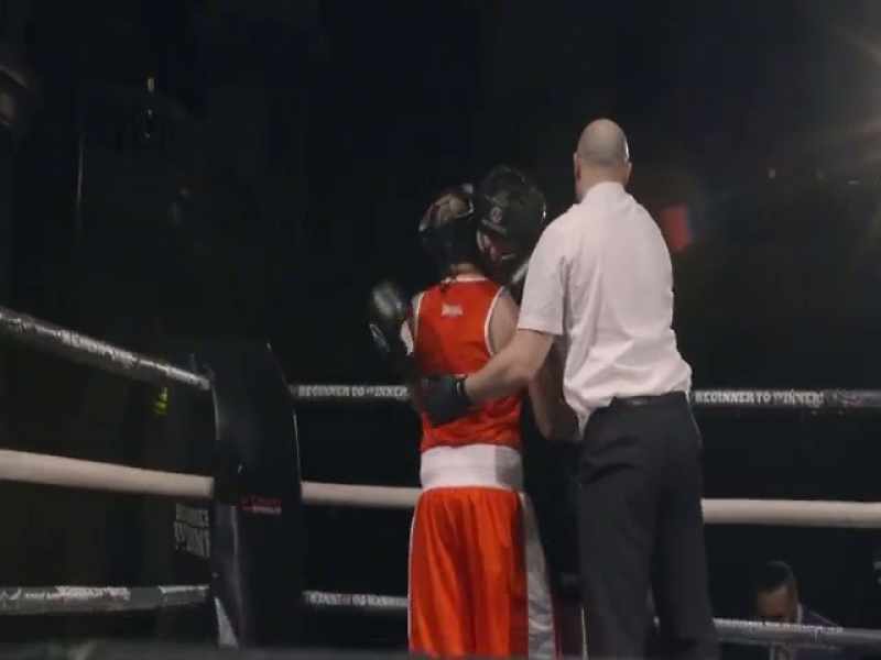 [boxing bell rings]