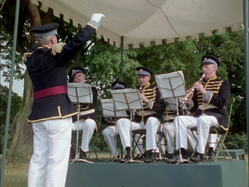 (brass band playing)