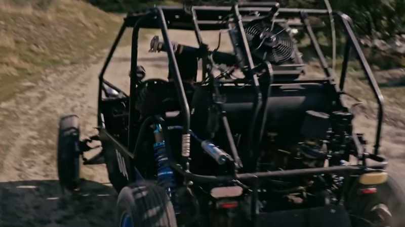 (buggy engine roaring)