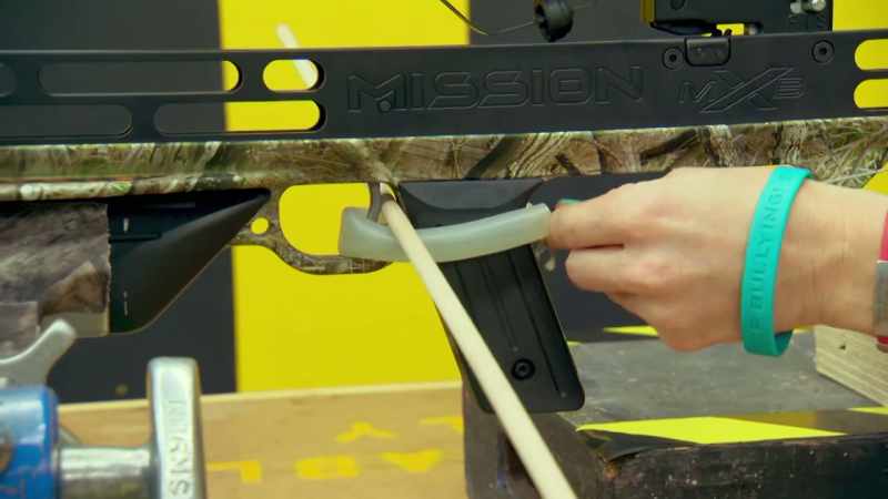 BUT THE COMPOUND BOW SHOT INTO THE SAME HOLE EVERY TIME