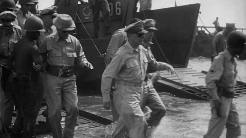 By afternoon, MacArthur wades ashore