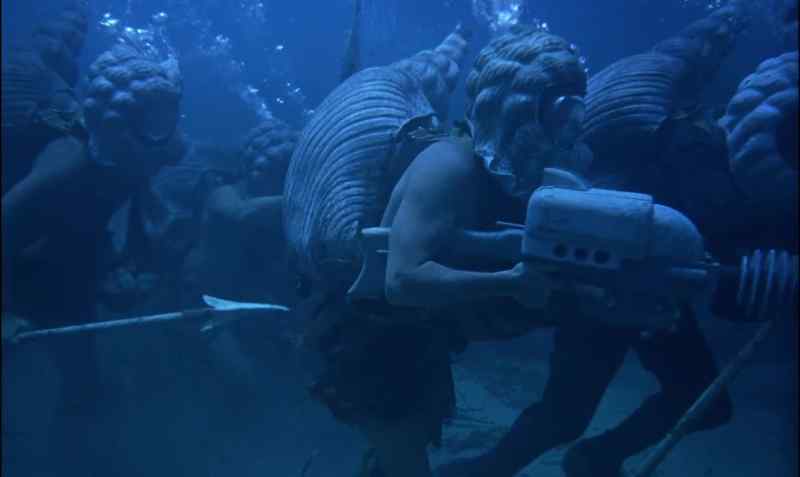 By learning to breathe and walk on the seafloor