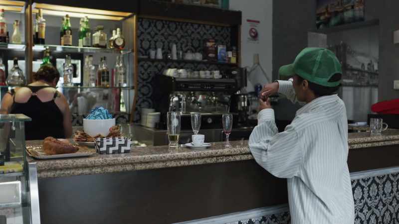 (cafe chatter) -(girls whispering)