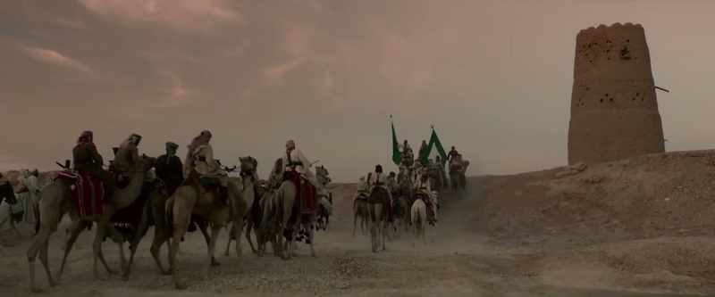[Camels walking]
