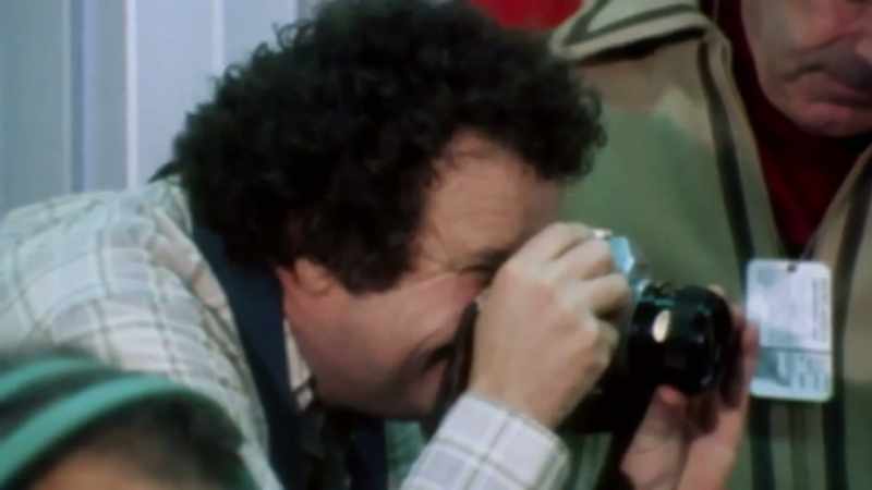[Camera shutters clicking]