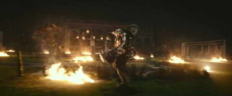 [car alarm blaring] [grunts]