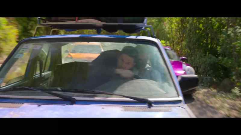 [car horn blaring]