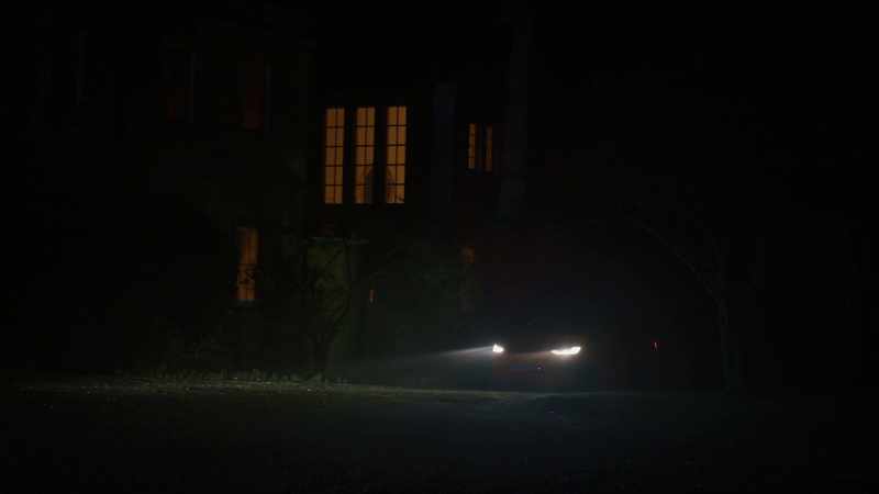 [car pulling up on gravel]