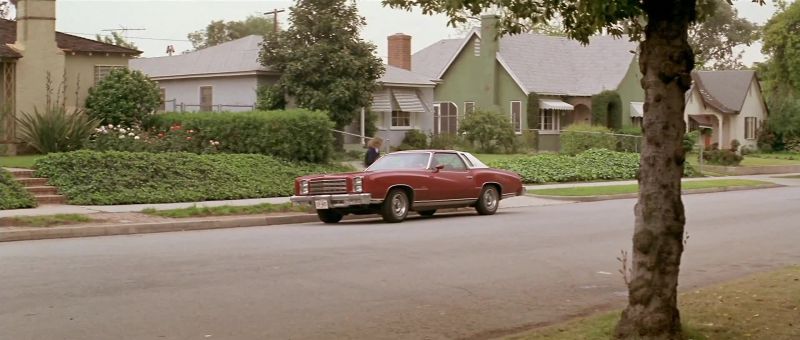[CAR RADIO PLAYING ROCK 'N' ROLL SONG]
