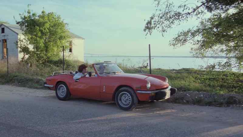 (car revs) (radio starts)