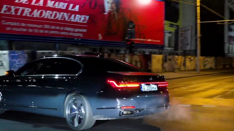 [CAR WHOOSHES BY]