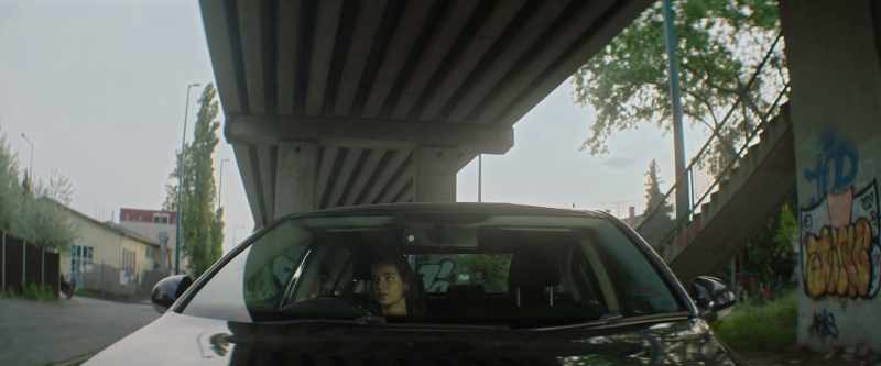 (cars whir overhead)