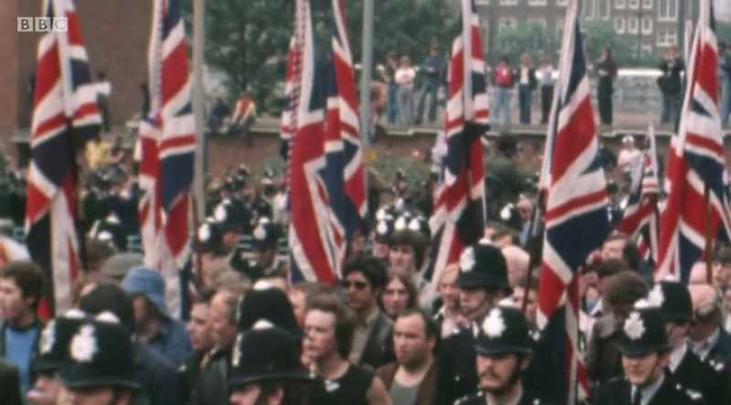 [chanting] National Front! National Front!